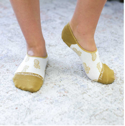 These women's no-show socks are from Royal standard the toe and the heel is the same color eithe or beige or blue  the beige have pineapples on them and the blue have abstact patterns