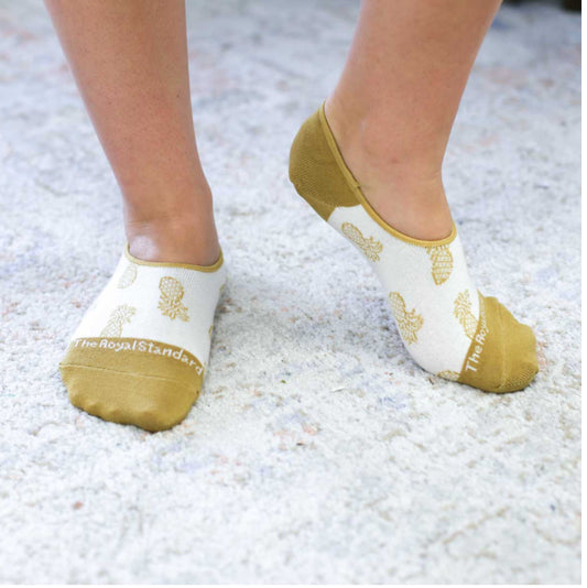 These women's no-show socks are from Royal standard the toe and the heel is the same color eithe or beige or blue  the beige have pineapples on them and the blue have abstact patterns