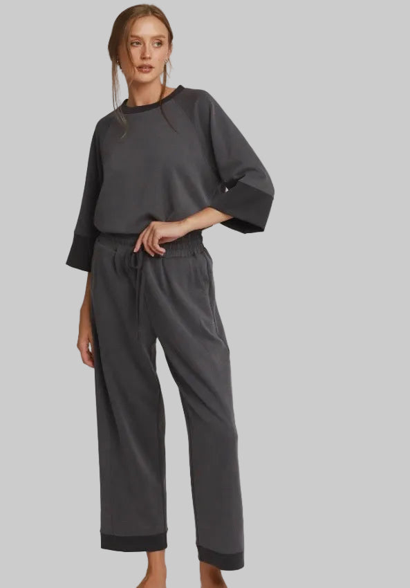 Charcoal colorblock raglan top with black cuffs and collar and matching drawstring trousers with black hem detailing. Available in all sizes.