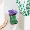 Jumpin Puddles Minis vase, shaped like small green galoshes. Available in mini size. Holds flowers.