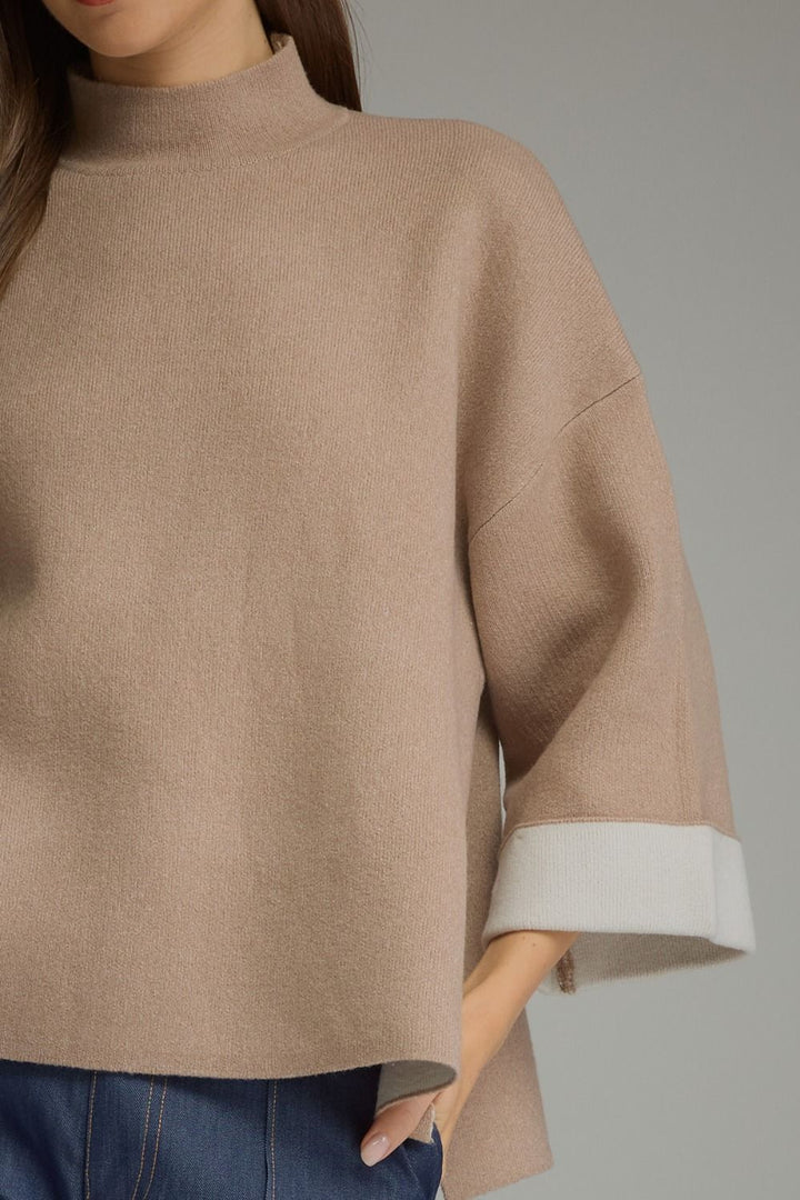 Contrast Mock Neck Sweater in tan with wide, contrast-colored cuffs on three-quarter sleeves. Available in all sizes.