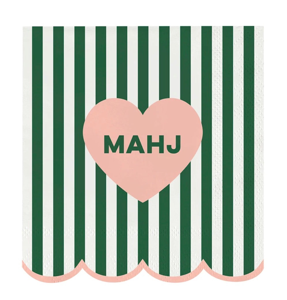 Mahj Cocktail Napkins feature vertical green and white stripes, scalloped pink edges, and a central pink heart with “MAHJ.” Available in cocktail size.