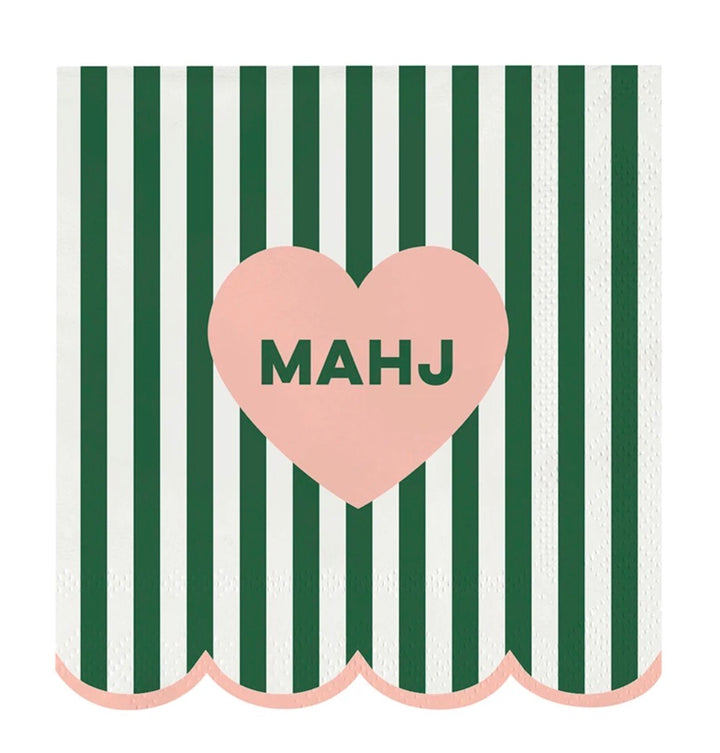 Mahj Cocktail Napkins feature vertical green and white stripes, scalloped pink edges, and a central pink heart with “MAHJ.” Available in cocktail size.