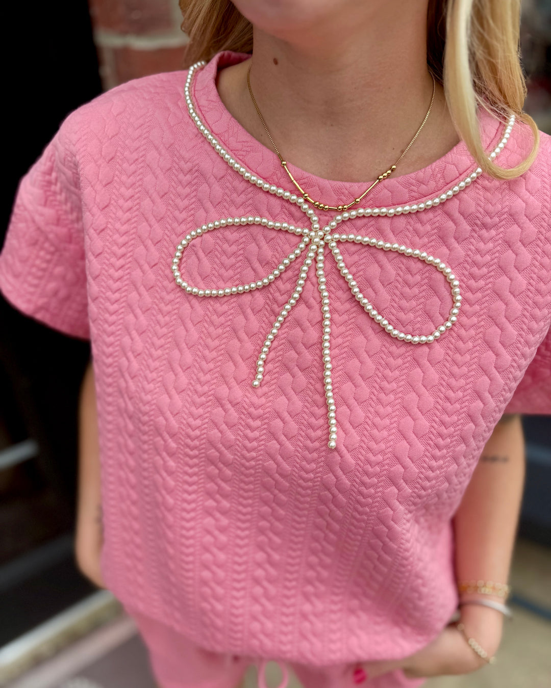 Pearl Pink Ribbon Trim Textured Set with pearl bow detail at neckline; available in sizes XS–XL.