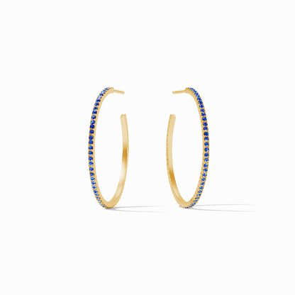 Large CZ hoop earrings with pavé blue gemstones and 18K gold plate. Available sizes: small, medium, large.
