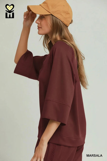 Marsala Butterfly Lace Raglan Sleeve Top with lace detail. Available in sizes XS–XL.