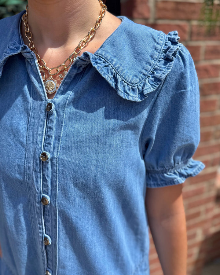 Denim Ruffle Collar Mini Dress with ruffled collar and puff sleeves; available in sizes XS-XL.