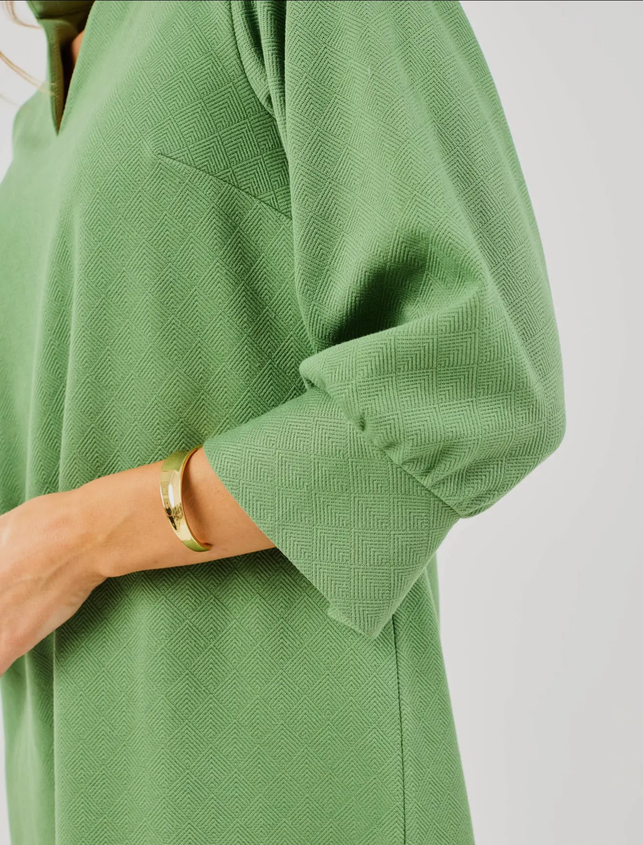 Hadley Green Dress with textured fabric and long sleeves. Available in sizes XS–XL.