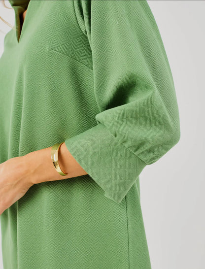 Hadley Green Dress with textured fabric and long sleeves. Available in sizes XS–XL.