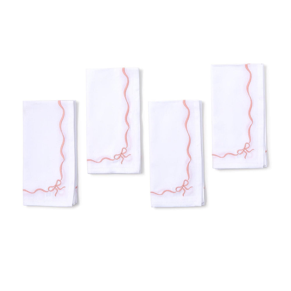 Set of 4 white cotton napkins with pink wavy borders, small pink bow in one corner. Size: 20"x20".