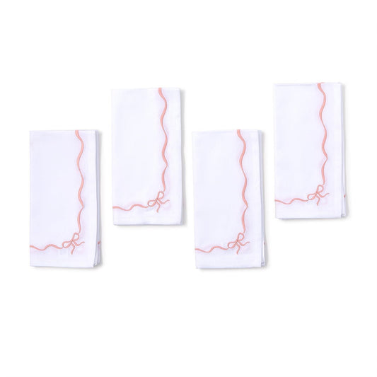 Set of 4 white cotton napkins with pink wavy borders, small pink bow in one corner. Size: 20"x20".