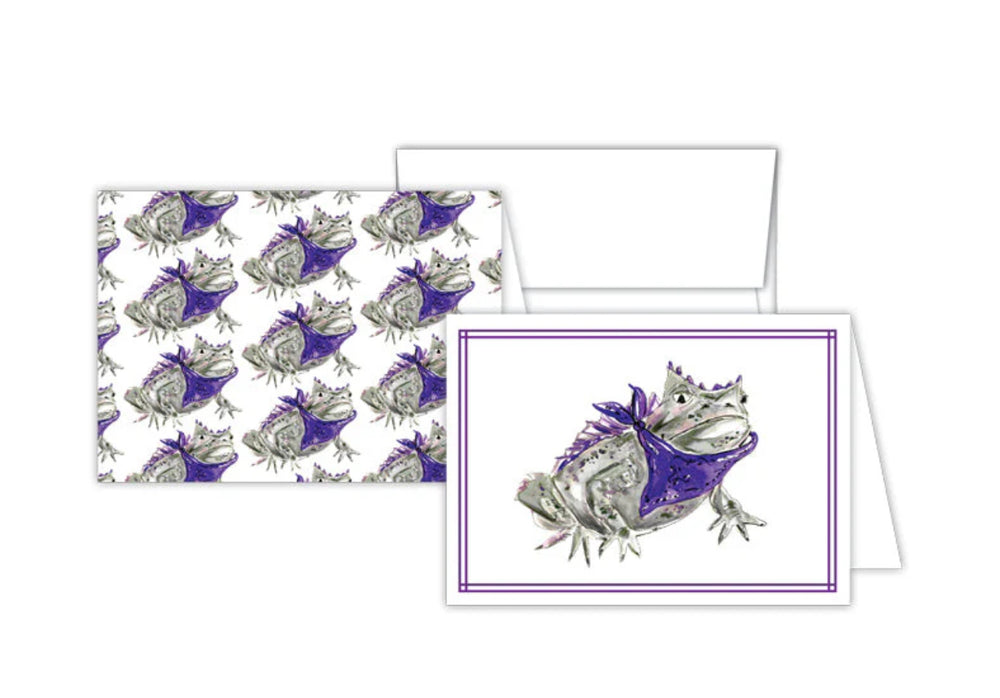 Petite Notes Handpainted set includes two greeting cards with a detailed illustration of a frog in a purple bandana. One card features the frog image framed, and the other displays it in a repeated pattern. Perfect for snail mail enthusiasts. Sizes available: Not specified.