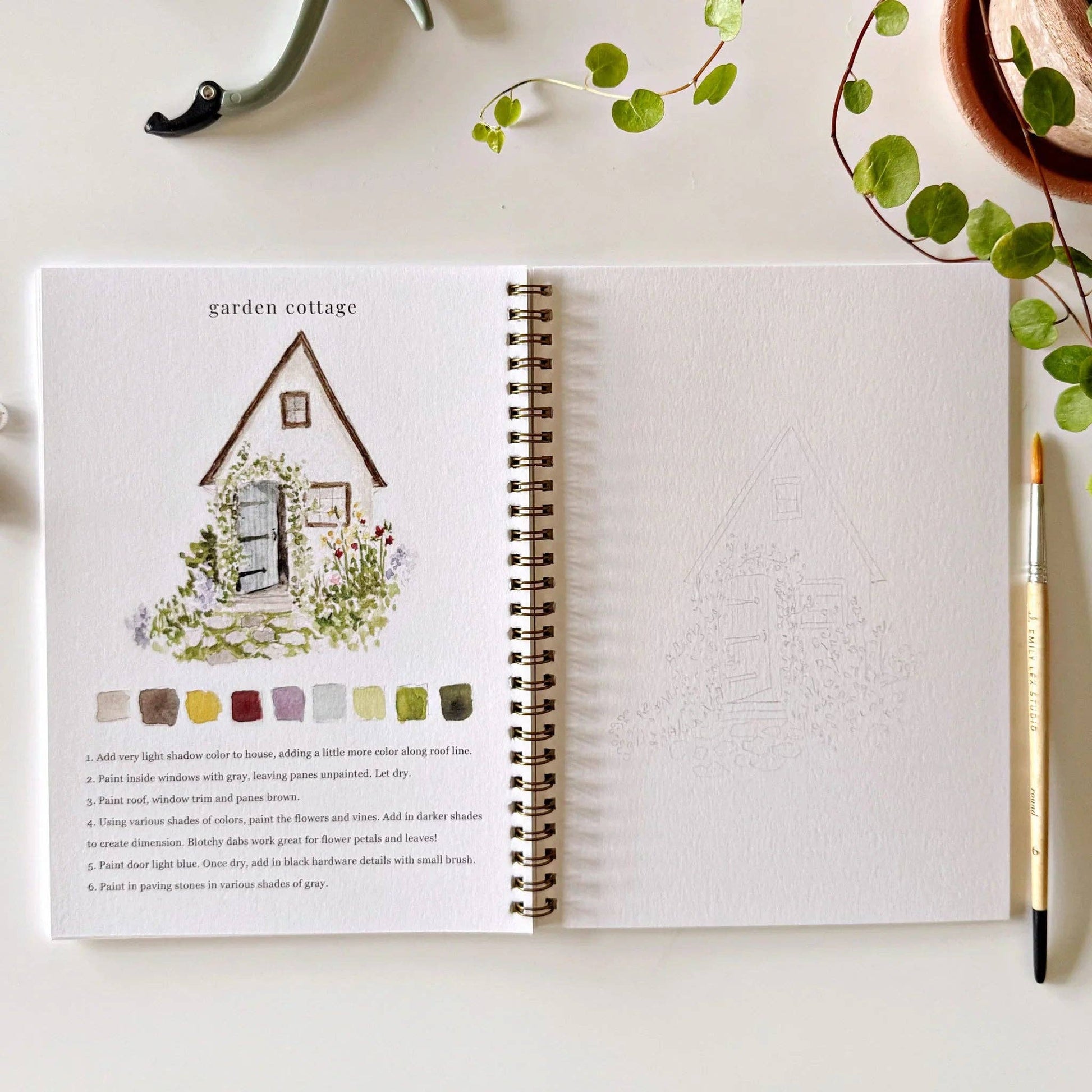 The Garden Watercolor Workbook, open to a garden cottage tutorial with swatches and instructions. Available in multiple sizes.
