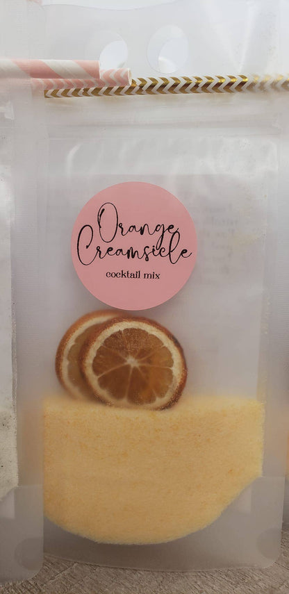 Clear pouch labeled "Adult Slush Drink Pouches," contains orange powder, dried orange slices, and a striped straw. Sizes: 8oz, 16oz.