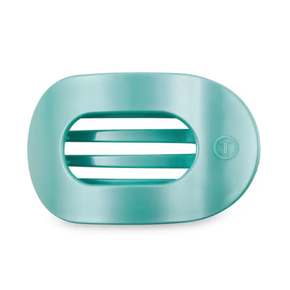 Teal oval soap dish with slotted drainage and small circular logo. Available in multiple sizes.