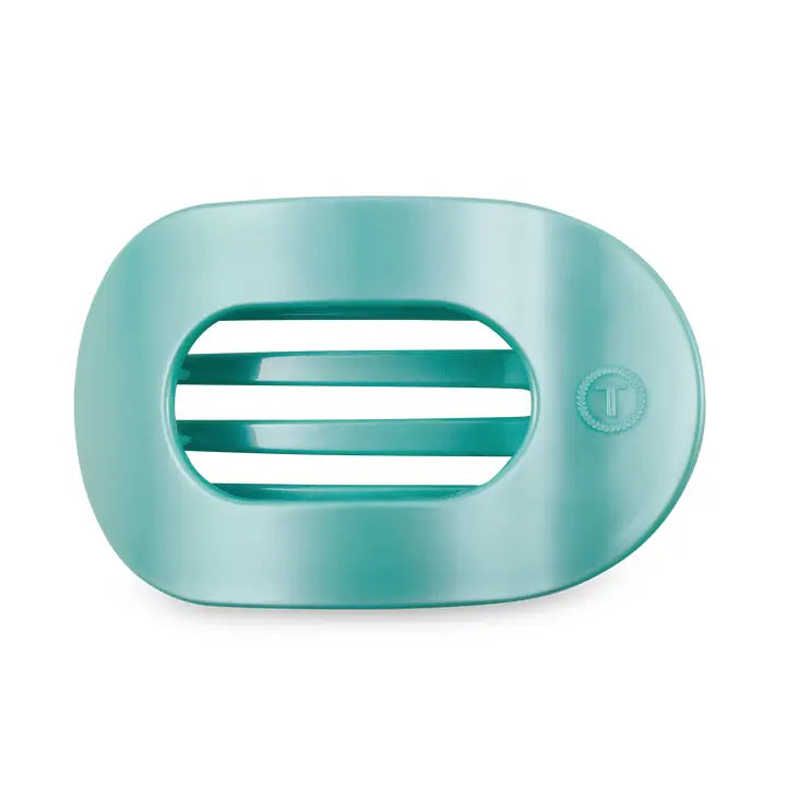 Teal oval soap dish with slotted drainage and small circular logo. Available in multiple sizes.