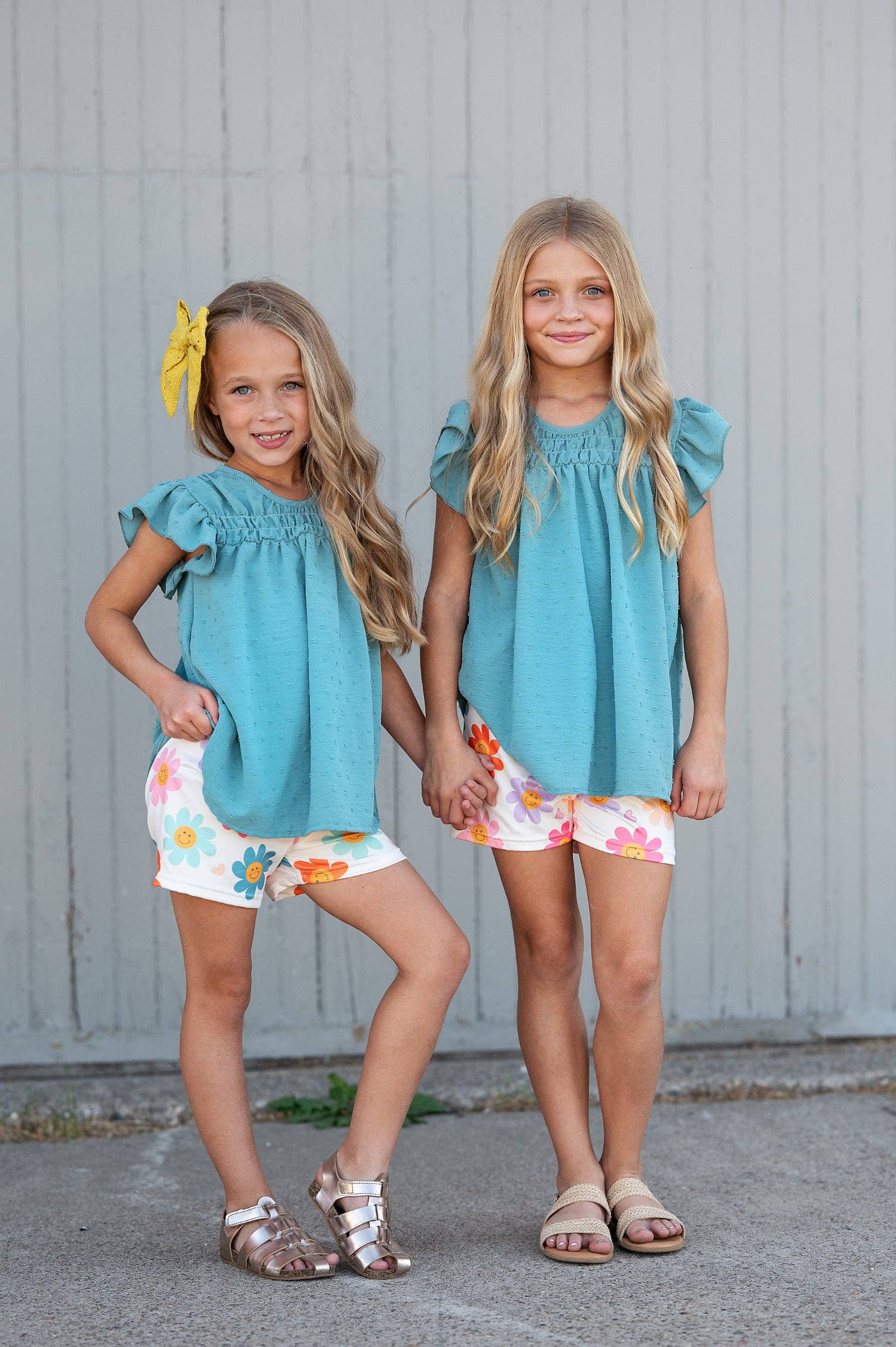 Girls Happy Flower Short Set: teal flutter sleeve top, retro daisy print shorts. Available in sizes 2T-8.