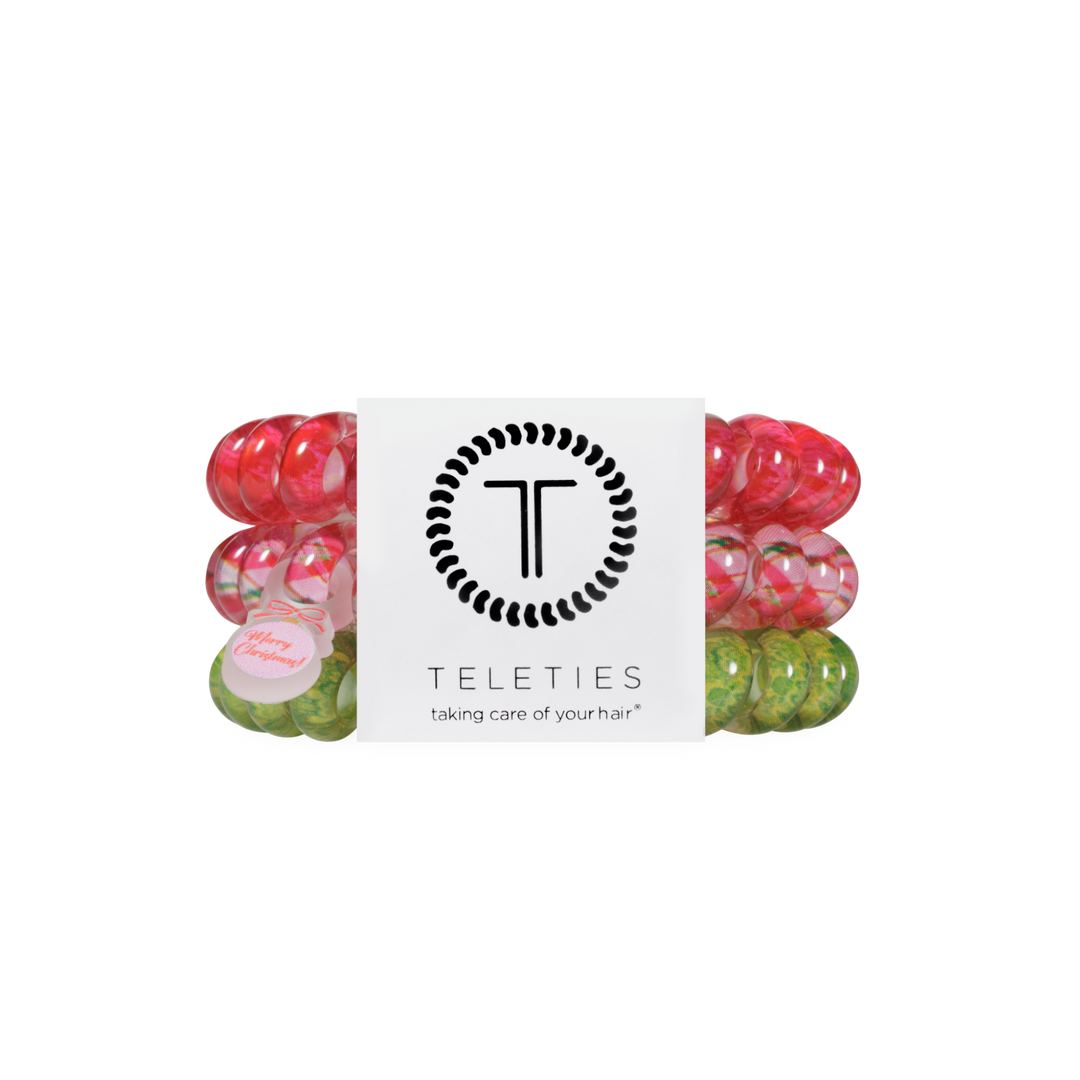 And to All a Good Night large red, pink, and green spiral coil hair ties with Merry Christmas tags.