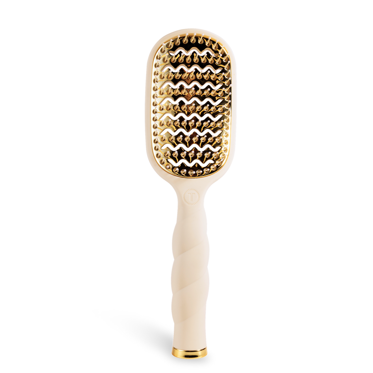 The Vented Hair Brush | Tan is a beige blowout brush with a gold-toned vented paddle, quick-heat aluminum plate, and twisted handle. Available in standard size.