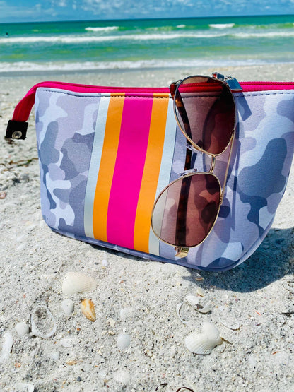 The Olivia Small Neoprene Makeup Bag features a camouflage pattern, pink-orange-yellow stripes, zipper closure; available in small.