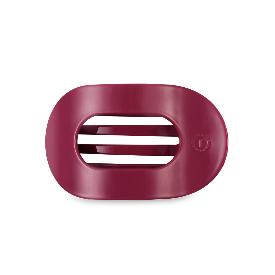 Maroon, oval TELETIES Flat Round Hair Clip with three drainage slits; available in medium and large sizes.