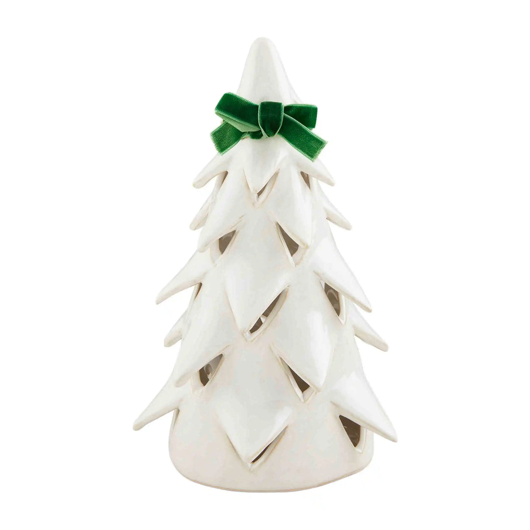 White stoneware Christmas tree sitters with green velvet bows.