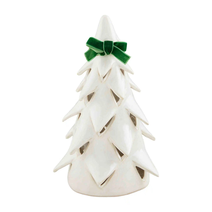 White stoneware Christmas tree sitters with green velvet bows.