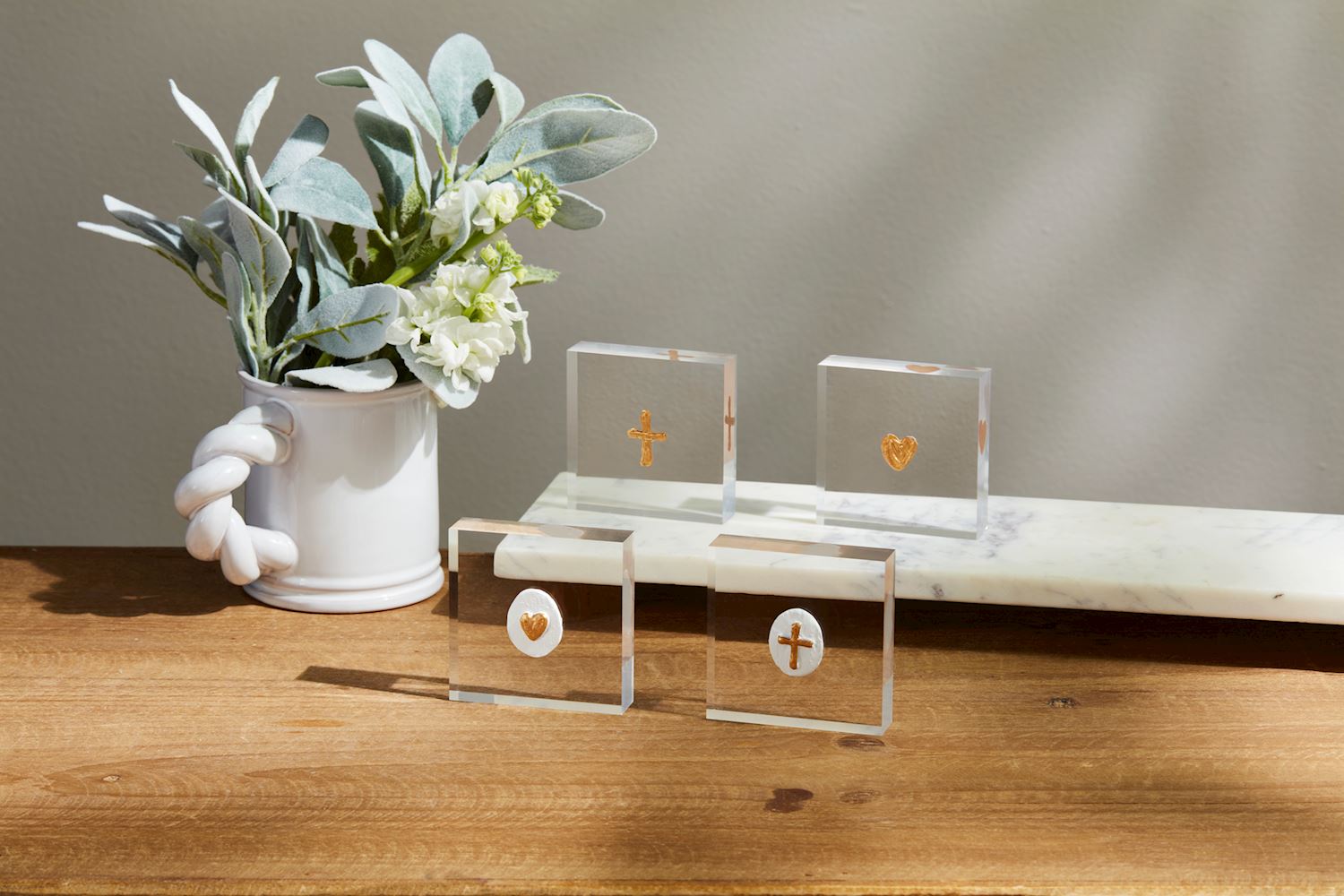 Mini Acrylic Icon Plaques with gold hearts and crosses, set on a white marble slab. Available sizes: Small.