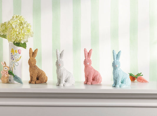 Set of 4 wicker resin bunnies in brown, white, pink, and blue. Available sizes: small, medium, large.