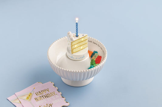 Cake Candle Holder Light-Up Sitter: hand-painted ceramic cake with blue light-up candle. Available in small and large sizes.