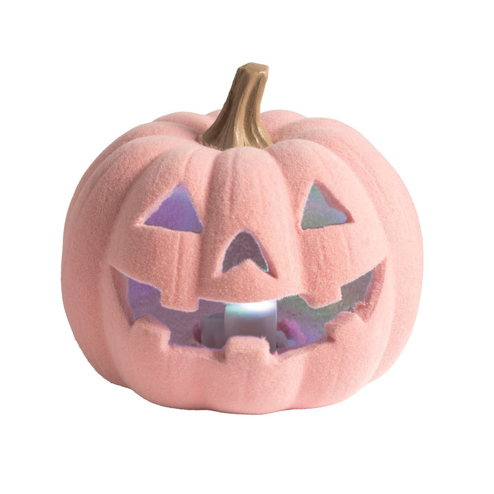 Pink flocked jack-o-lantern with carved smile and triangular eyes, brown stem, and glowing purple-blue LED interior. Sizes available: small, medium, large.