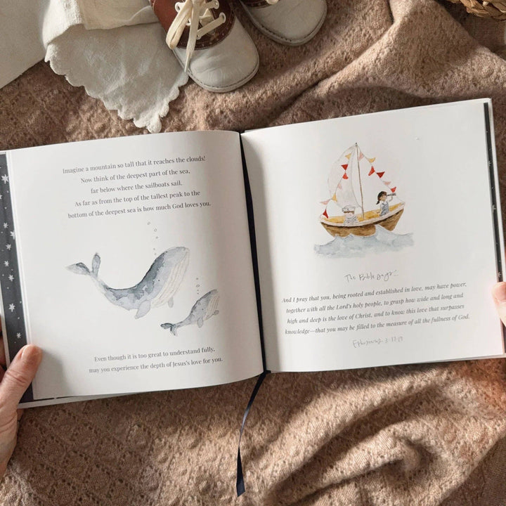 Open Bedtime Blessings book with whale and sailboat illustrations.