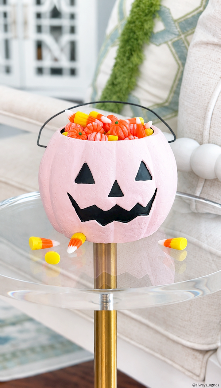 Mini Halloween Treat Bucket in pink pumpkin style with jack-o’-lantern face; hand-painted, available in three styles.