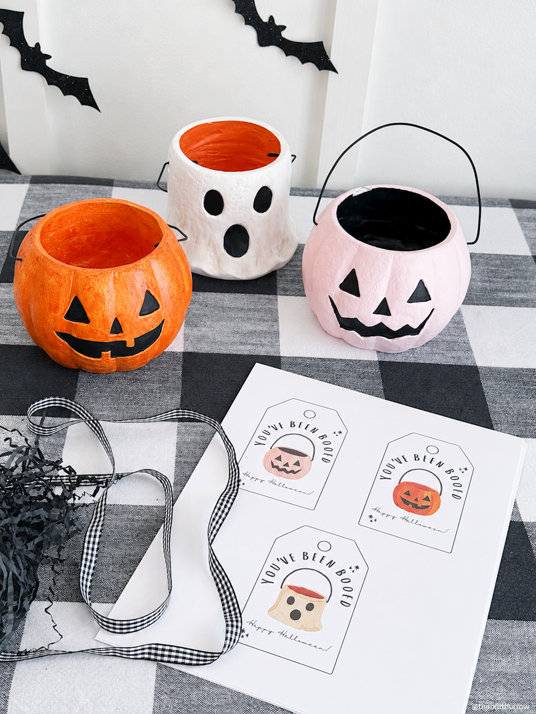 Three hand-painted Mini Halloween Treat Buckets in pumpkin, ghost, and cat designs. Available in three styles; sizes: 3″x4″.