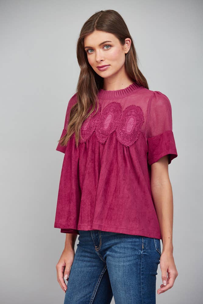 Teal blue short-sleeve faux suede top with sheer mesh upper panel and lace applique, size L.
