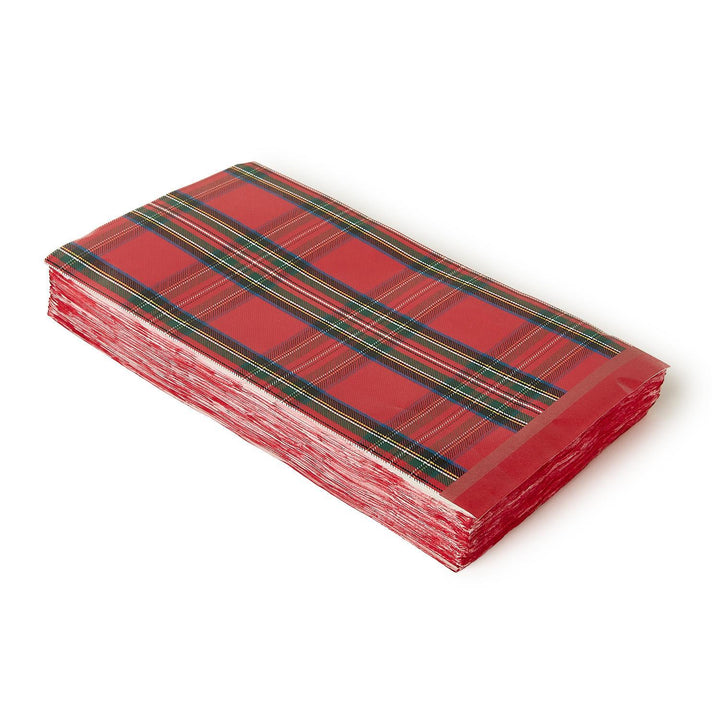 Stack of red, green, and navy tartan plaid paper dinner napkins/guest towels.