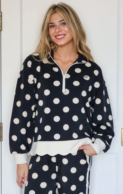 Harper Polka Dot Quarter Zip in black and white polka dots, available in sizes XS-XL.