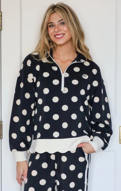 Harper Polka Dot Quarter Zip in black and white polka dots, available in sizes XS-XL.