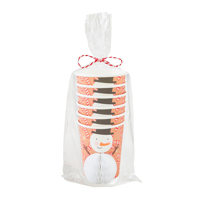 Stack of Christmas paper cups with snowman and candy cane prints in a clear bag tied with red and white string.