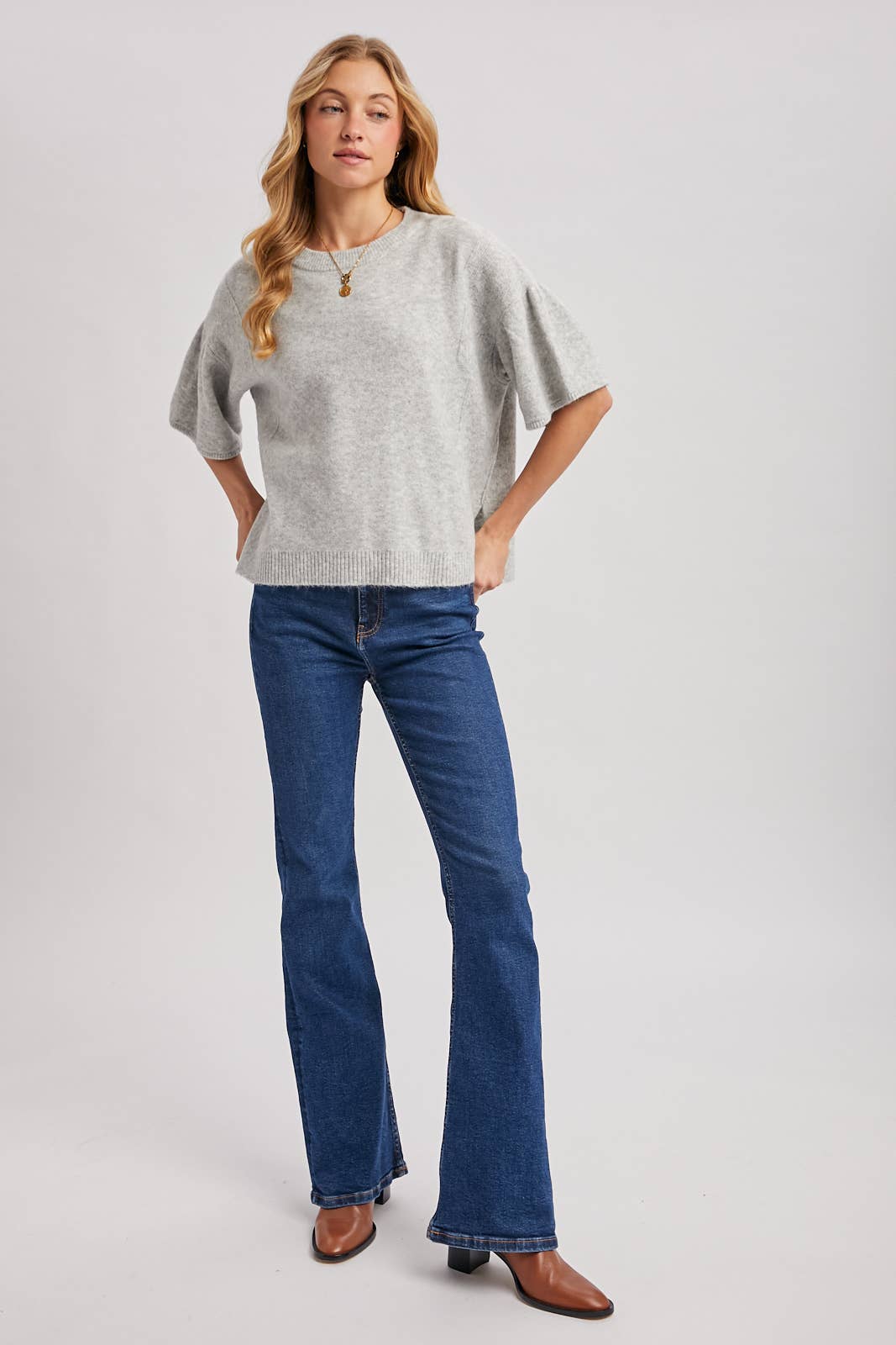 Light grey short-sleeved gathered boxy knit sweater top with a ribbed hem. Size: S/M.