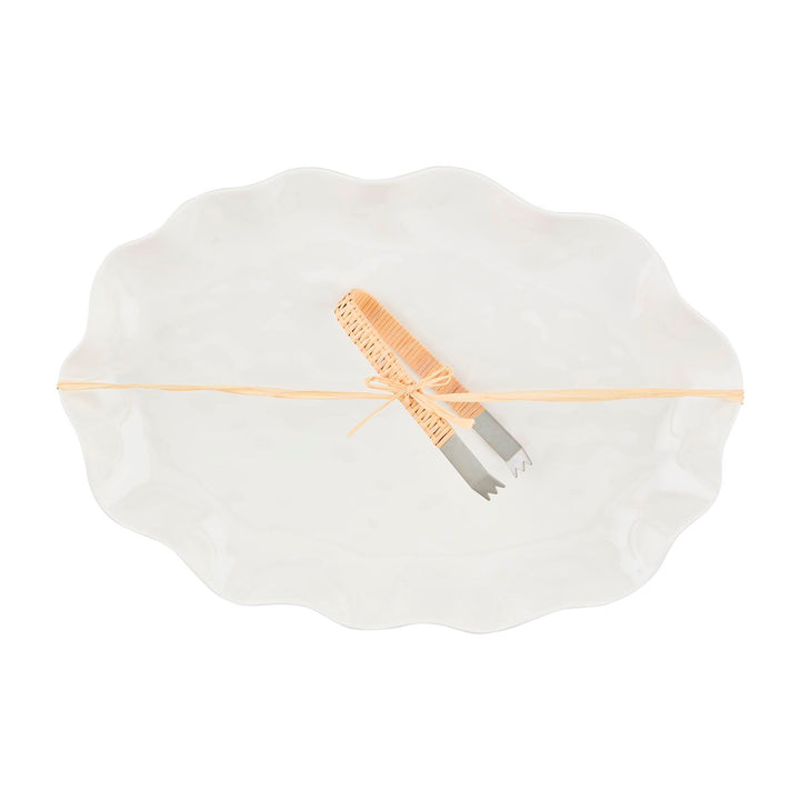 Sizes available: One size. Concise description: White melamine platter with ruffled edge, includes metal tongs with woven beige handles, tied with a beige ribbon.