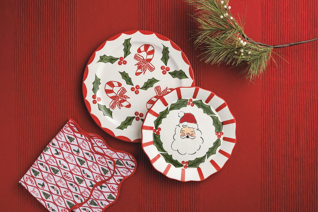 Two hand-painted ceramic platters from the Holly Santa Platter Set featuring Santa and candy cane designs.