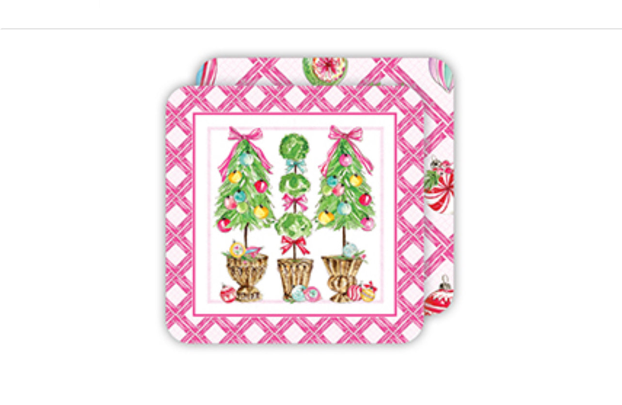 Handpainted napkin with a pink checkered border, central design of Christmas trees with ornaments and ribbons in pots, and scattered festive ornaments. Available Sizes: Not specified.