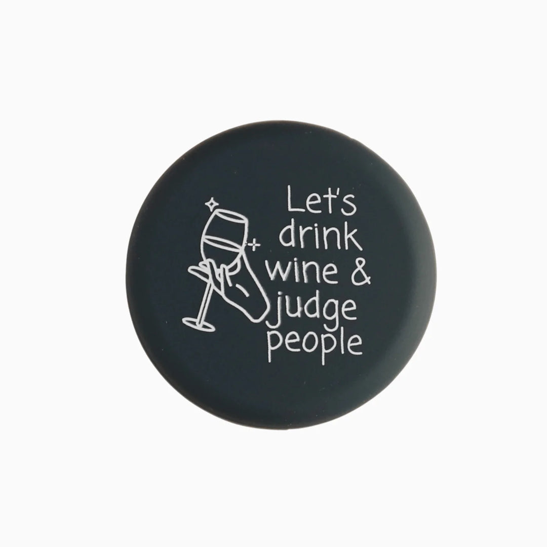 Round black Wine Cap with white hand holding wine glass, "Let&