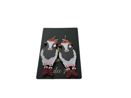 Cow Christmas Earrings—brown and white cow faces with red glitter boots. Festive, available in small and large sizes.