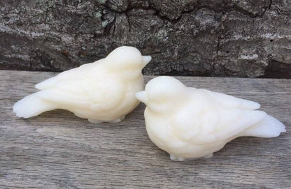 Two white, bird-shaped Sweet Birdy Guest Soaps: Secret Garden, made with shea butter. Available in guest soap size only.