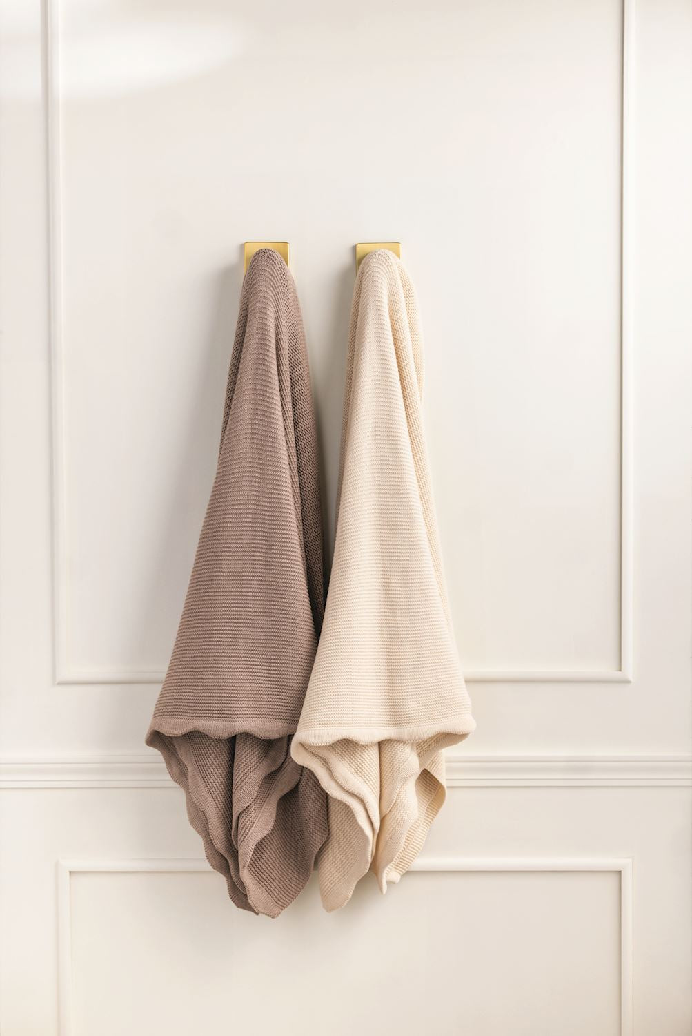 Scalloped throw blanket with textured taupe and cream design; available in 50"x60" and 60"x80" sizes.