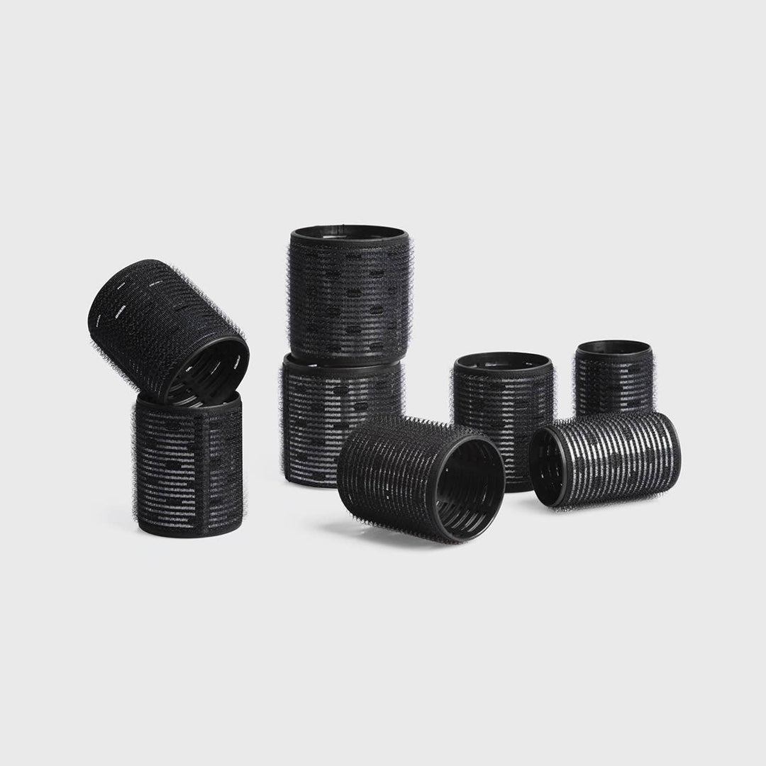 Eight black ceramic thermal rollers in assorted sizes from the Ceramic Hair Roller 8pc Variety Pack.