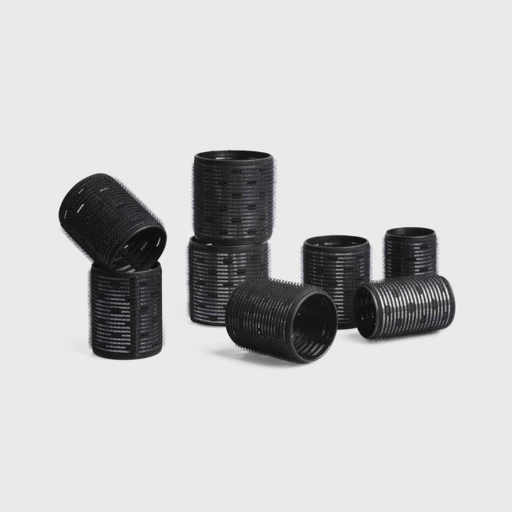 Eight black ceramic thermal rollers in assorted sizes from the Ceramic Hair Roller 8pc Variety Pack.