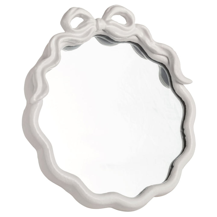 Round Metal Bow Mirror with scalloped white frame and metal bow on top. Available in 16", 24", and 32" sizes.